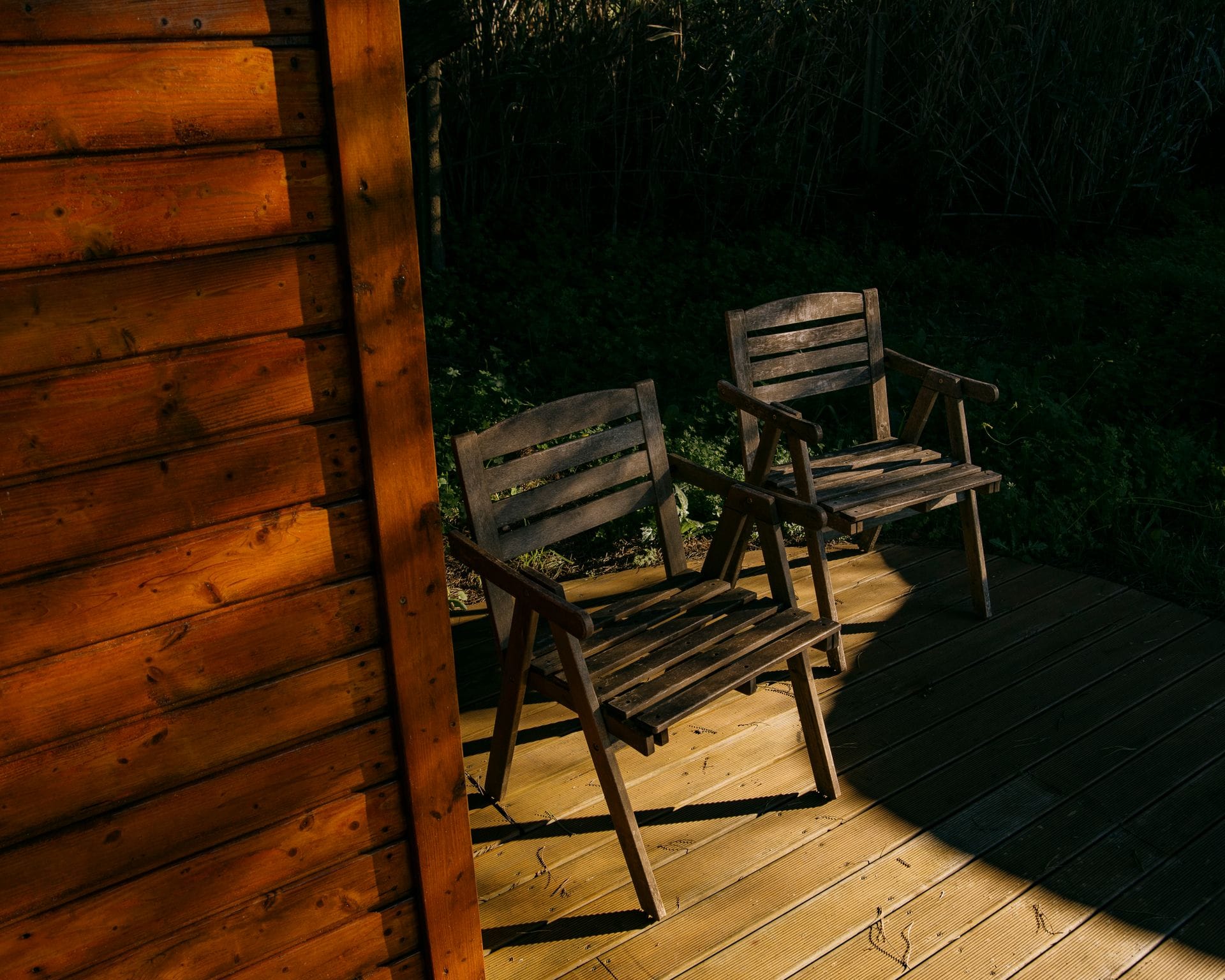 Timber-clad garden room with redwood decking and glazed double doors