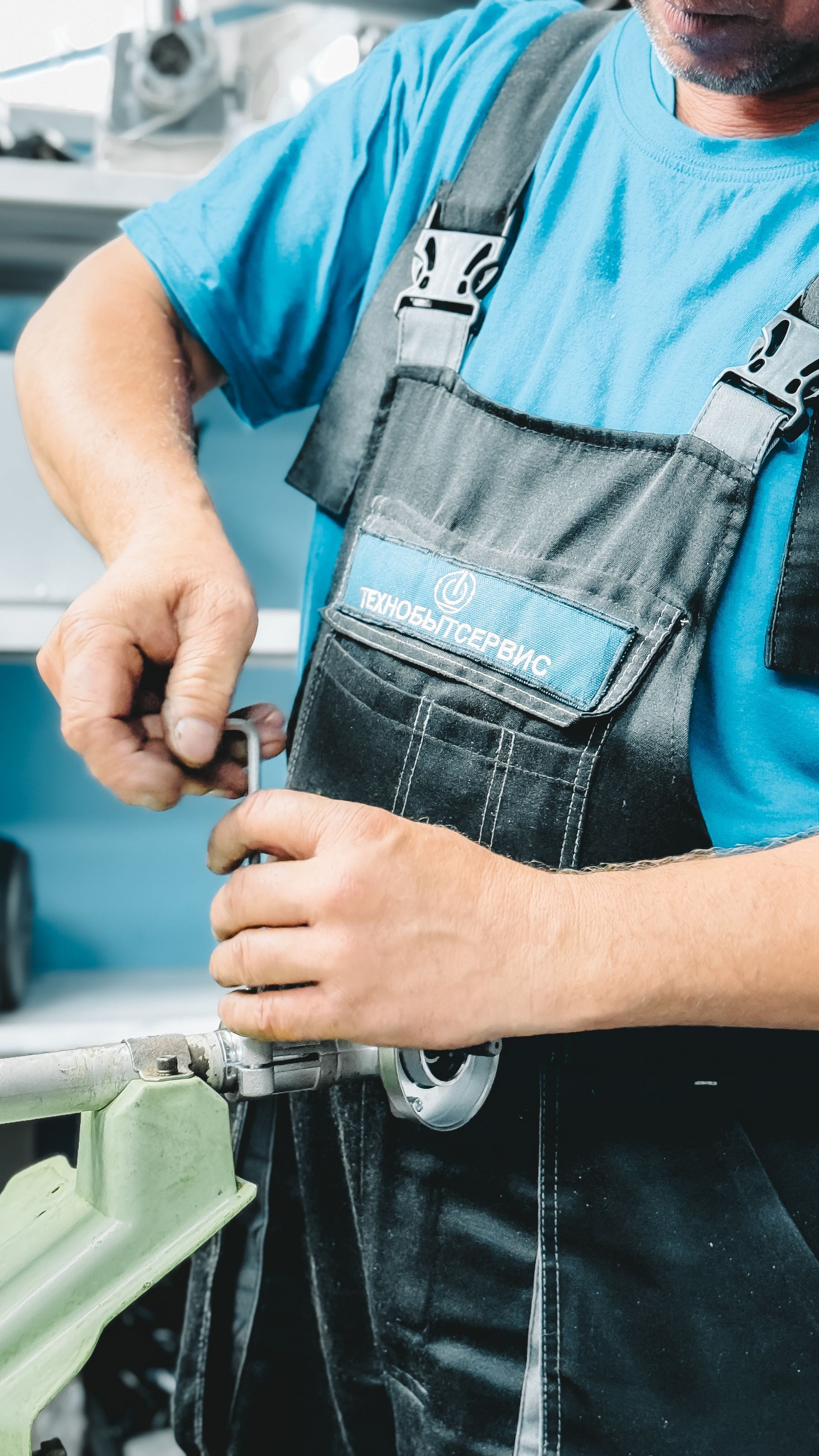 Plumber repairing a boiler in a home in Exampleton