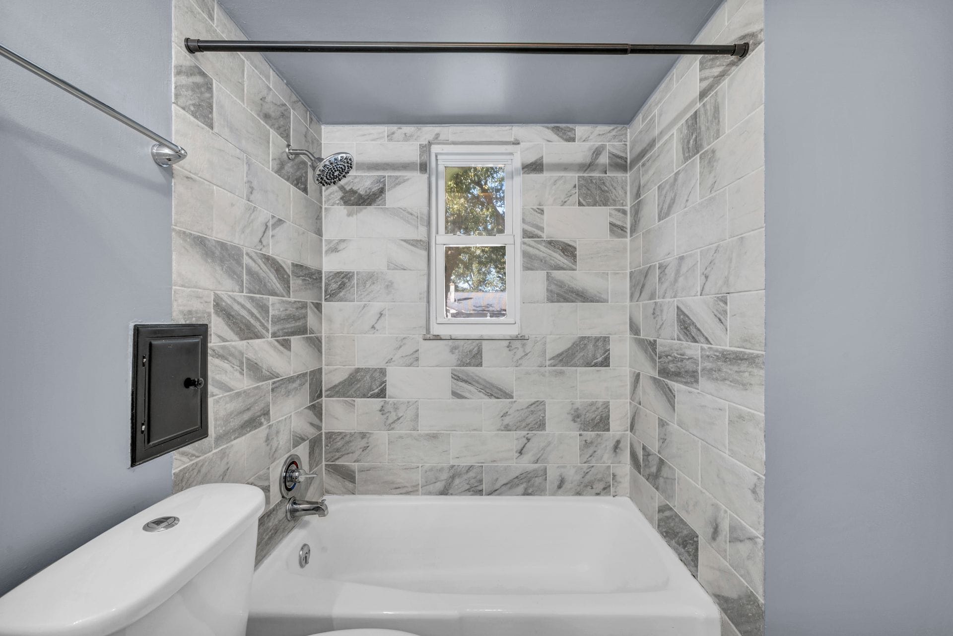 Plumber's finished bathroom installation in Exampleton