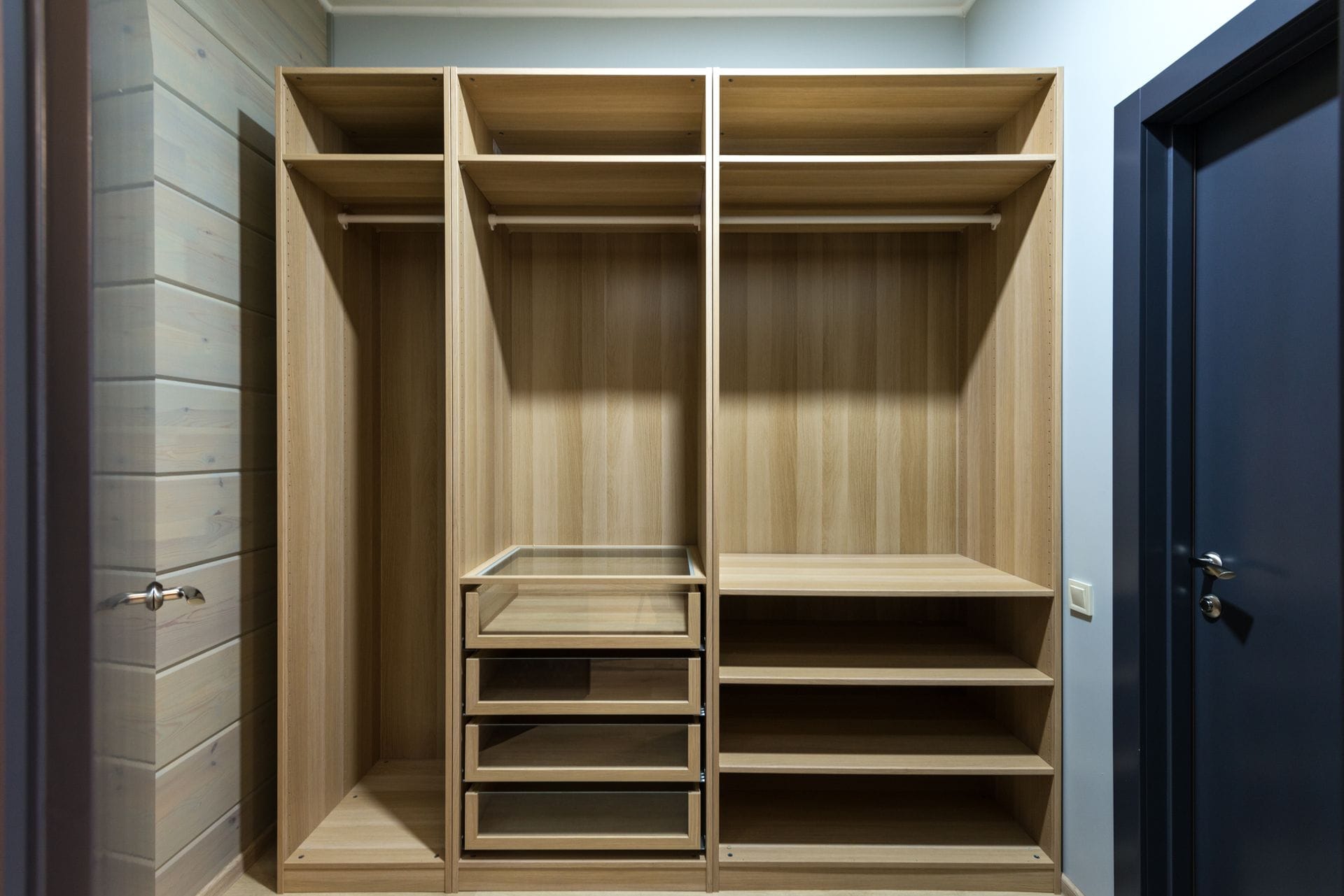 Finished bespoke fitted wardrobes by a joiner in Exampleton