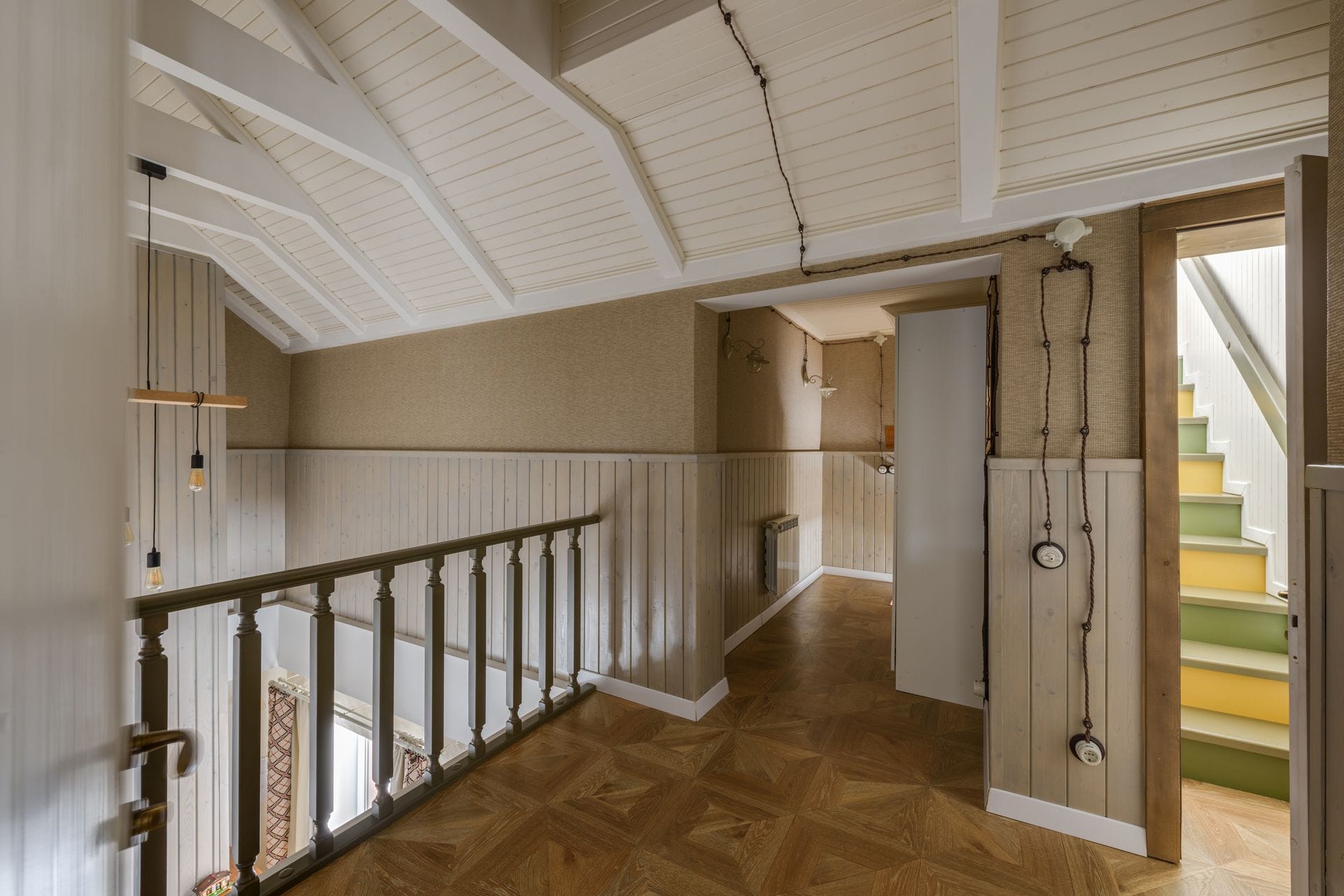 Oak staircase with turned newel posts and open risers in a hallway